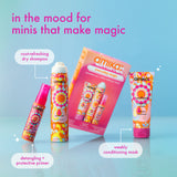 Amika hair care product set with colorful packaging on a light blue background
