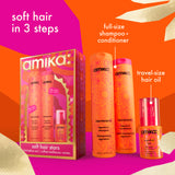 Amika Soft Hair Stars hair care set featuring a full-size shampoo and conditioner bottle, a travel-size hair oil bottle, and the retail box, displayed on a bright orange and magenta graphic background with text labels.