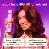 model holding a bottle of amika big hit volumizing shampoo. text: ready for a big hit? benefits: boosts volume 2.3x*, weightless moisture, touchable volume, softens + detangles. *clinically proven when using big hit shampoo and conditioner together as a system. 