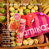 Amika Guava Granita product set with dry shampoo, travel pouch, and sample size on a fruit-themed background.