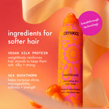 amika's soulstruck nourishing dry hair mask stands upright on a warm gradient background. text on the left reads: ingredients for softer hair, vegan silk protein: weightlessly reinforces hair strands to keep them soft, silky + strong, sea buckthorn: helps increase shine, manageability, softness + strength. a pink bubble on the right says “breakthrough technology.”