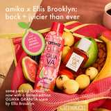 Amika x Ellis Brooklyn product set with guava granita flavor, including shampoo and oil, surrounded by fruits and nuts.