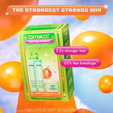 A promotional image for Amika's 'Play Your Strength' strength repair routine set, featuring a vibrant green box with retro-inspired designs against a colorful sky with floating orange balloons. The text at the top reads 'The Strongest Strands Win' in an orange and white gradient banner. The product packaging displays the items included in the set: The Kure Shampoo, The Kure Conditioner, and The Kure Intense Bond Repair Mask. Overlaid text highlights the benefits: '3.2x stronger hair*' and '55% less breakage