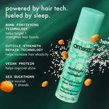 Amika midnight mender hair treatment bottle with product features on a green background