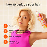 Woman with blonde hair holding a can of hair product with instructions on how to use it.