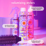 Amika volumizing stylers with a hairbrush on a purple background. brooklyn bombshell: pre-blowout primer for volume + body. rising star: finishing spray for instant root lift. plus size: mousse for touchable body + bounce. 