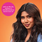 Woman with long, wavy hair against an orange background with a purple text bubble.