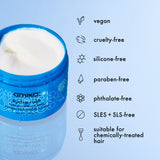 Amika product with vegan, cruelty-free, silicone-free, paraben-free, phthalate-free, SLES + SLS-free, and chemically-treated hair compatible icons and text on a light blue background.