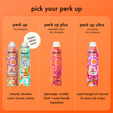 Amika dry shampoo products with packaging design on an orange background