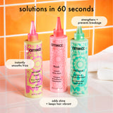 bottles of amika 60-second treatments stand on a white tiled surface, with an orange tiled background. Text: "solutions in 60 seconds: (the kure multi-task) strengthens + prevents breakage, (smooth over) instantly smooths frizz, (flash instant shine mask) adds shine + keeps hair vibrant. 