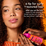 Woman applying oil to her hair with text about tips for curly and textured hair.