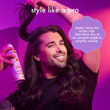 image: model using amika rising star volumizing finishing spray. text: style like a pro -apply rising star at the root, then blow dry at an upward angle to amplify volume. 