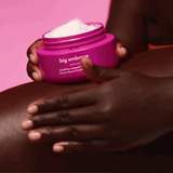 gif of a model applying big embrace whipped body butter to their thigh