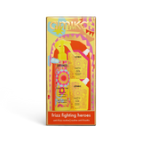 Amika Frizz Fighting Heroes set in its original packaging, featuring a yellow and orange illustrated box with a spray bottle and travel-sized shampoo and conditioners visible through the front window.
