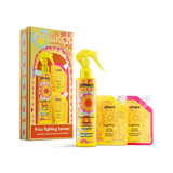 Amiko Frizz Fighting Heroes hair care set including a spray bottle, two treatment pouches, and a decorative product box, all in bright yellow packaging with colorful floral graphics on a white background.