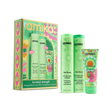 Amika 'Kurated Strength' haircare gift set featuring a colorful patterned box alongside three light green bottles and a matching tube: shampoo, conditioner, and mask. The products are arranged on a clean white background.