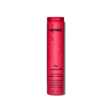 A tall cylindrical bottle of Amika The Protector Color Protected Strengthen Conditioner, featuring a vibrant pink-red body with a matching cap, set against a plain white background.