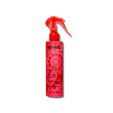 Amikor 'The Protector' hair color protectant spray bottle in a vibrant red and pink floral pattern, shown on a clean white background.